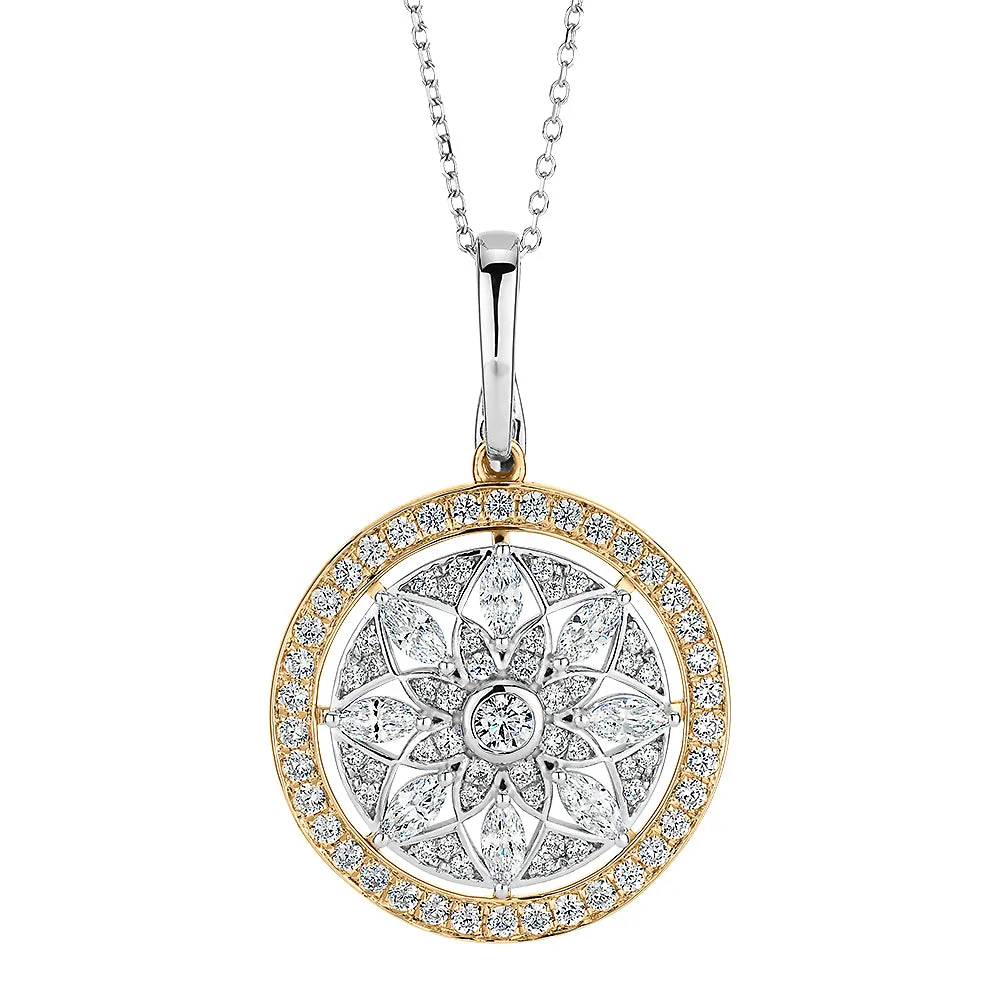 Fancy pendant with 1.43 carats* of diamond simulants in 10 carat yellow gold and sterling silver